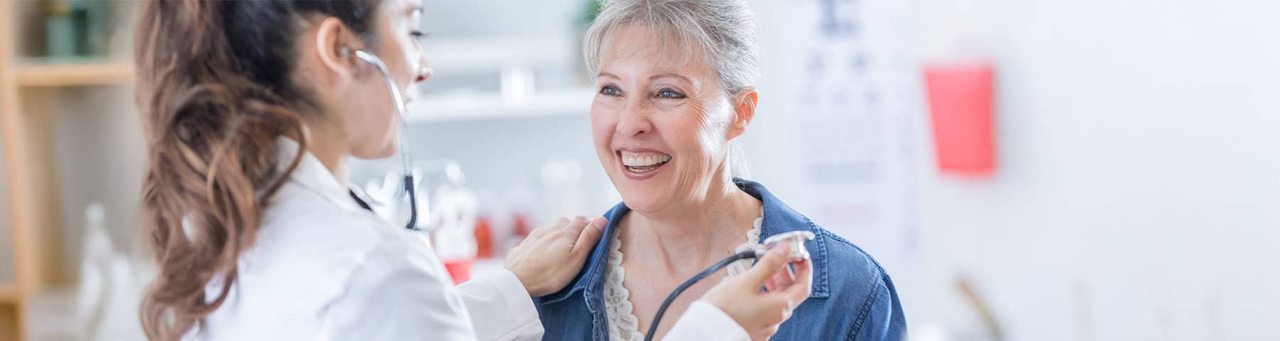 Clinician assessing a patient’s heart rhythm during an exam